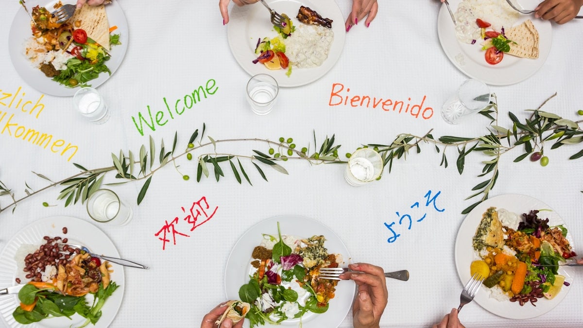 a multicultural lunch or dinner with friends around a welcome table